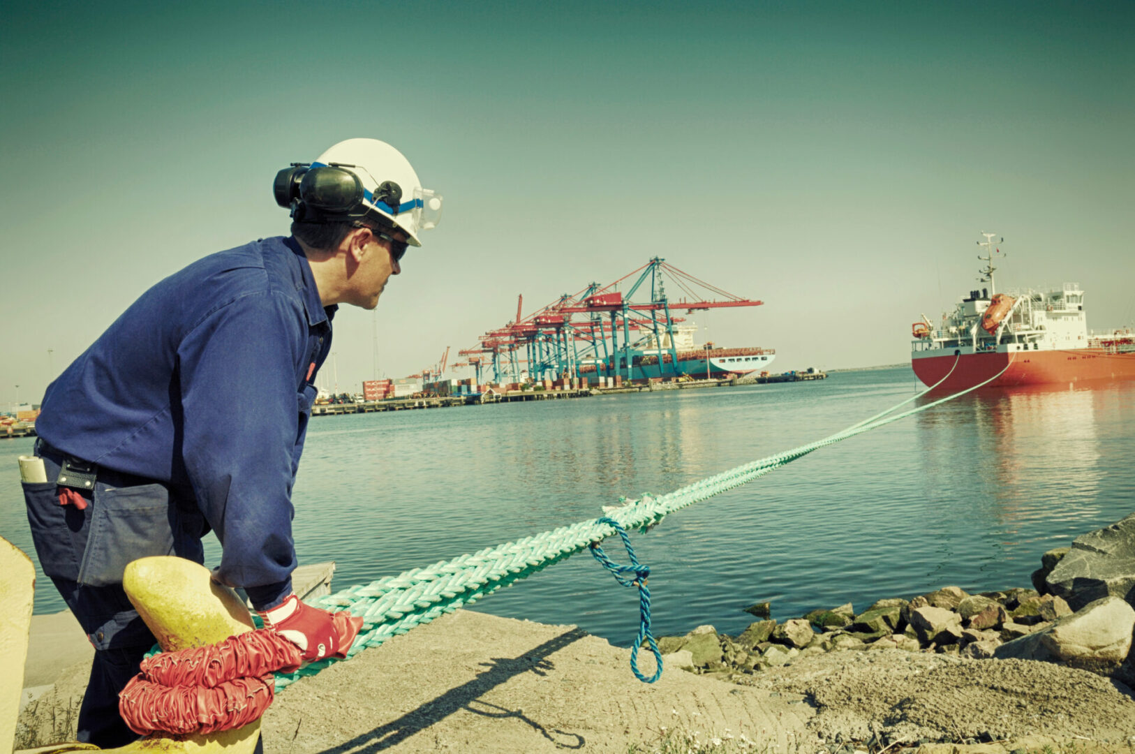 port worker moring large container ship